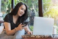 Happy woman working using multiple devices on a desk at coffee shop Royalty Free Stock Photo