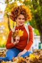 Happy woman with a wreath of maple leaves on her head Royalty Free Stock Photo