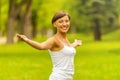 Happy woman in wreath outdoors summer enjoying life opening hand Royalty Free Stock Photo