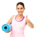 Happy Woman With Yoga Mat Gesturing Thumbs Up