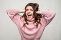 Happy young woman gesturing emotional of good news while isolated on white