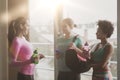 Happy women with bottles of water in gym Royalty Free Stock Photo