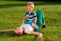 Happy woman and child having fun outdoor on meadow Royalty Free Stock Photo