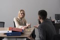 Happy woman discuss company money with man. Woman boss smile with financier in office. Businesswoman and manager at work Royalty Free Stock Photo