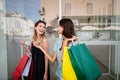 Happy women friends having fun and shopping in the city Royalty Free Stock Photo