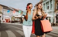 Happy women friends having fun and shopping in the city Royalty Free Stock Photo