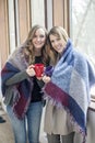 Happy women friends at home in winter Royalty Free Stock Photo