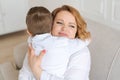 Happy woman have fun with cute baby boy 5-6-7 years old in white shirt. Mom Royalty Free Stock Photo