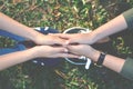 Happy women hold hands on nature