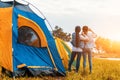 Happy women looking through binoculars together between camping Royalty Free Stock Photo