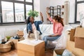 happy women moving to new home and counting money Royalty Free Stock Photo