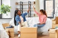 happy women moving to new home and counting money Royalty Free Stock Photo