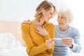 Cheerful relatives looking at each other and feeling happy