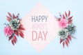 Happy Women`s Day Pastel Blue and Pink Colored Background. Flat lay floral greeting card with beautiful silk flowers. Royalty Free Stock Photo