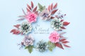 Happy Women`s Day Pastel Blue and Pink Colored Background. Flat lay floral greeting card with beautiful silk flowers. Royalty Free Stock Photo