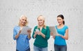 Happy women with smartphone and tablet pc computer