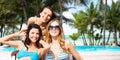 Happy women sunbathing in chairs on summer beach Royalty Free Stock Photo