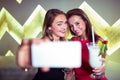 Happy women taking selfie in nightclub Royalty Free Stock Photo