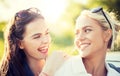 Happy women or teenage girls laughing outdoors Royalty Free Stock Photo