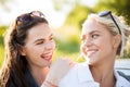 Happy women or teenage girls laughing outdoors Royalty Free Stock Photo