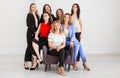 Happy women work team employees group looking at camera posing in studio, smiling women company staff workers, workforce members,