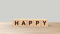 Happy word Wooden cubes on table horizontal over gray light background HD, mock up, template, banner with copy space for text, Royalty Free Stock Photo