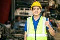 Happy worker Asian male man with safety suit work in engineering factory hand thumbs up sign Royalty Free Stock Photo