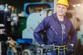 Happy worker.engineer smiling for service maintenance fix machine in heavy industy with safty suit and helmet Royalty Free Stock Photo