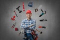 Happy worker handyman  Jack of all trades  or builder with construction tools Royalty Free Stock Photo