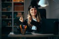 Cheerful Businesswoman in Flapper Girl Costume Dancing in office Royalty Free Stock Photo