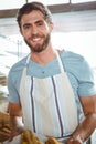 happy worker holding a basket of croissant Royalty Free Stock Photo