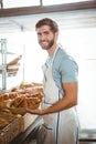 happy worker holding a basket of croissant Royalty Free Stock Photo