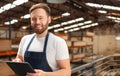 Happy worker looking at camera portrait at warehouse