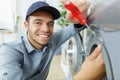 Happy worker screwing washer Royalty Free Stock Photo