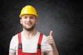 Happy worker showing thumbs up sign