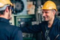 Happy worker, smiling industrial technician engineer enjoy working together with coworker