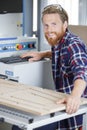 happy worker with wood shaper machine Royalty Free Stock Photo