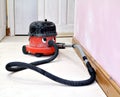 Happy working hoover vacuum cleaner Royalty Free Stock Photo