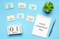 Happy World Compliment Day. Office desk with plant, notebook, pen and paper slips with compliments text for office worker such as Royalty Free Stock Photo