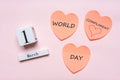 Happy World Compliment Day. Pink paper stickers in heart shape with text WORLD COMPLIMENT DAY on pink pastel background. Calendar