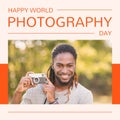 Happy world photography day text in orange with smiling african american man holding camera in park