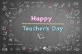 Happy world teacher`s day concept on black chalkboard and doodle