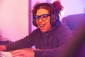 Happy, wow or woman gamer on computer with microphone playing games, streaming or fun on tech. Smile, excited or esport