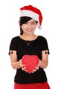 Happy Xmas girl holding heart shaped box Royalty Free Stock Photo