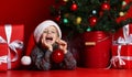 Happy xmas and New Year. Portrait of child in Santa red hat waiting for Christmas gifts. Royalty Free Stock Photo