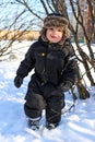 Happy 2 year toddler with rosy cheeks in winter