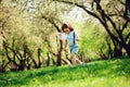 Happy 3 years old child boy catching butterflies with net on the walk in sunny garden or park Royalty Free Stock Photo