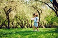 happy 3 years old child boy catching butterflies with net on the walk in sunny garden or park. Spring and summer outdoor activitie Royalty Free Stock Photo