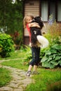 Happy 8 years old child girl playing with her spaniel dog Royalty Free Stock Photo