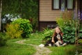 Happy 8 years old child girl playing with her spaniel dog outdoor Royalty Free Stock Photo